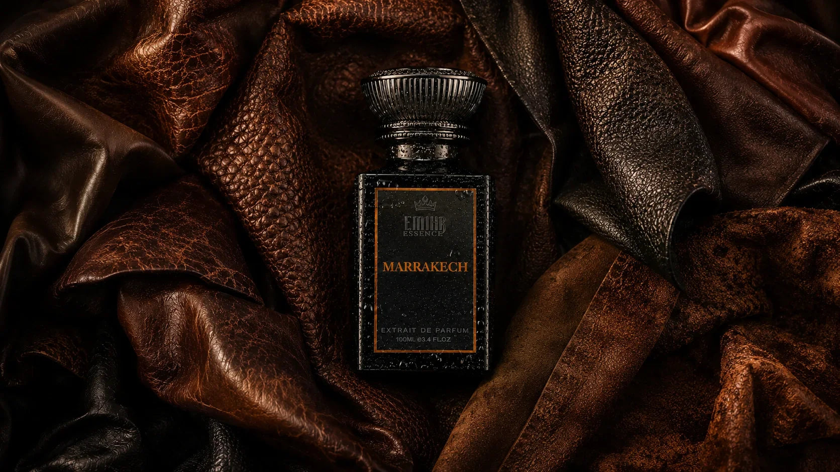 EMIHR Essence Marrakech leather fragrance bottle surrounded by premium leather hides, representing one of the best leather fragrances for men.
