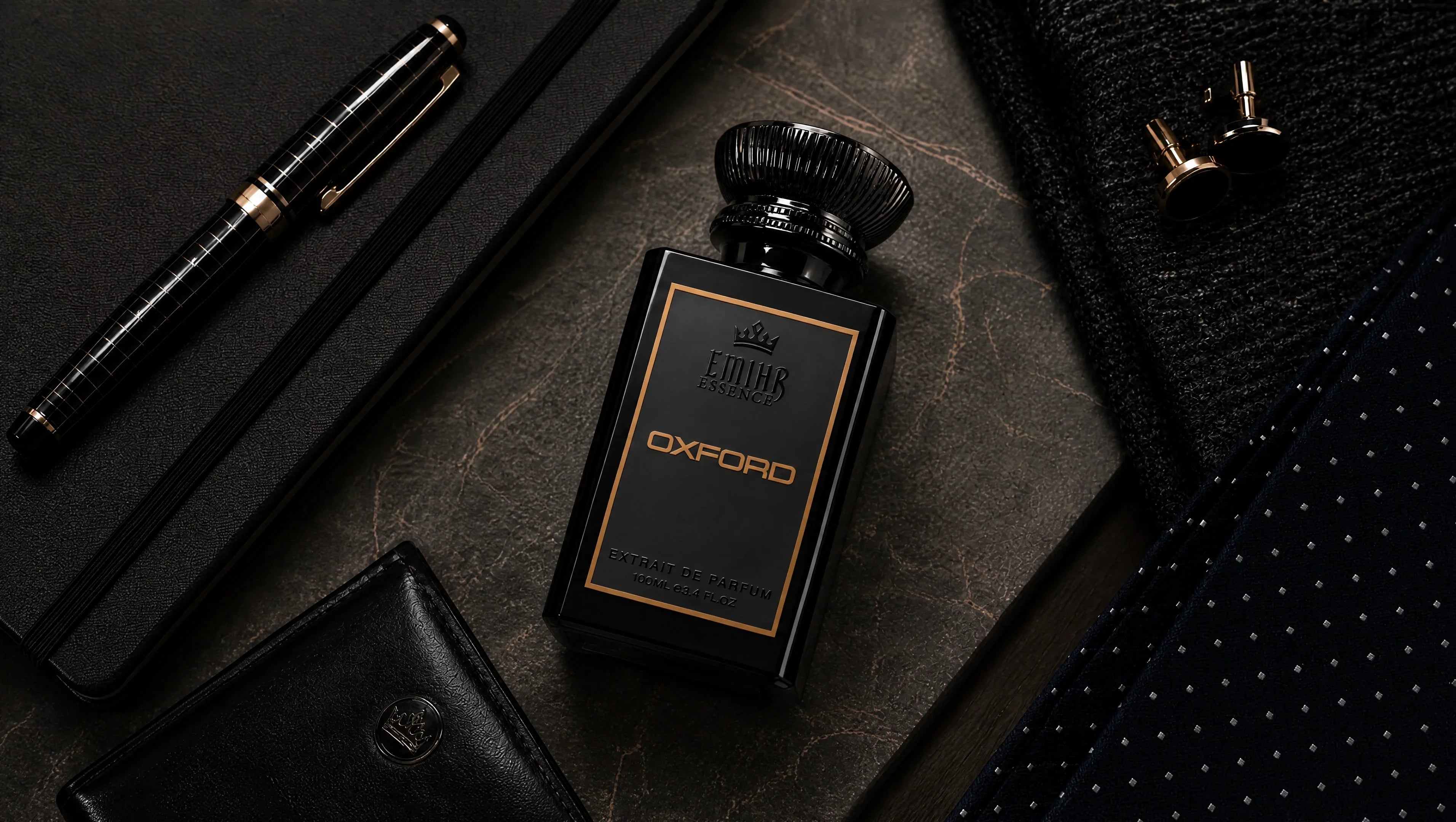 EMIHR Essence Oxford office fragrance bottle on a professional desk with notebook, pen and tie, representing one of the best office fragrances for men.
