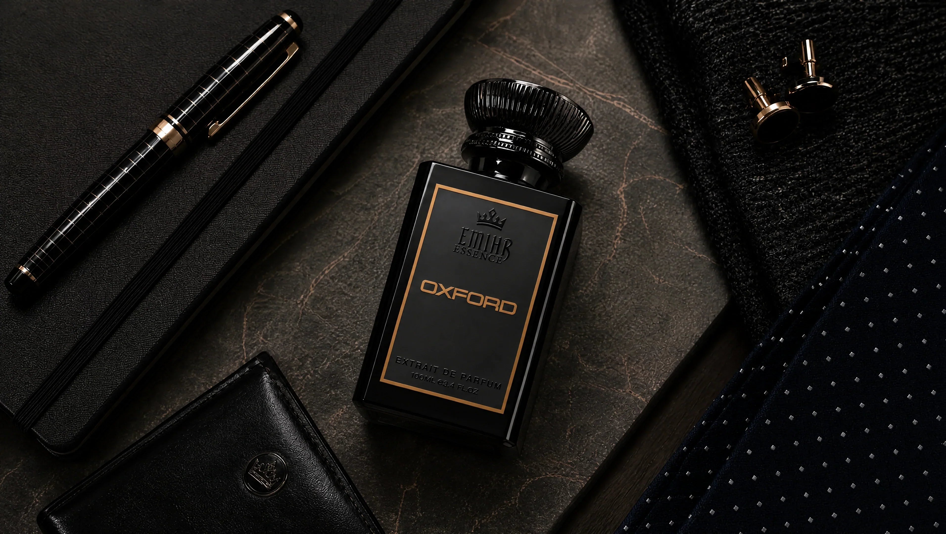 EMIHR Essence Oxford office fragrance bottle on a professional desk with notebook, pen and tie, representing one of the best office fragrances for men.